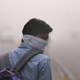 A man wearing a makeshift pollution mask.